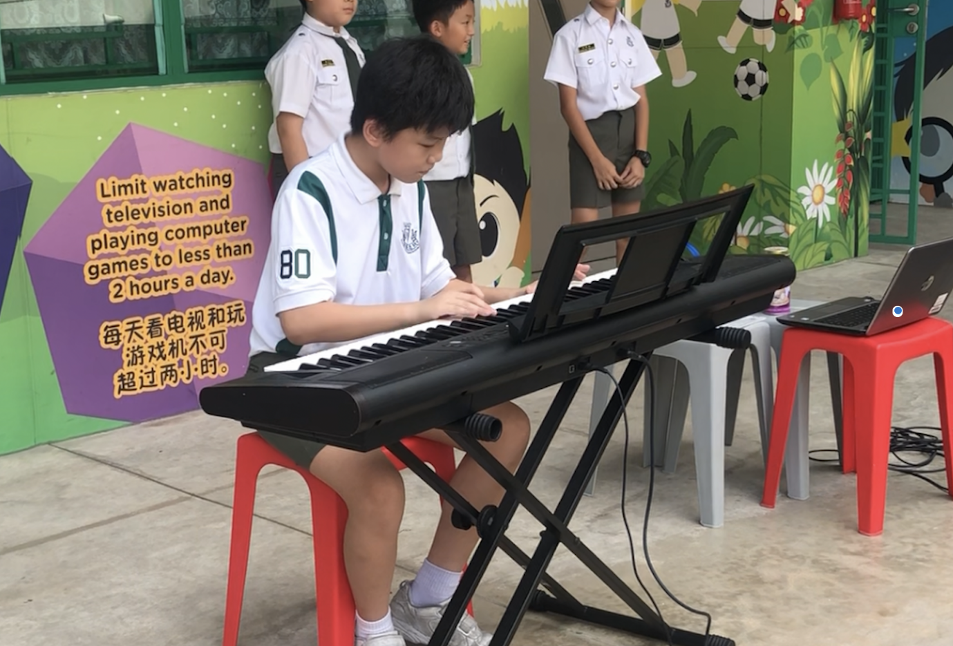 A pupil performing for Busking@CHS. (The picture was taken during pre-COVID)