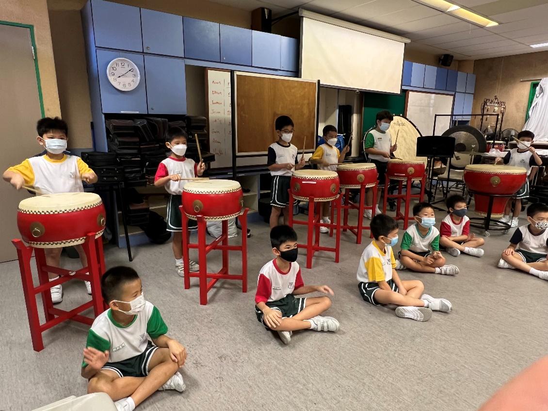 Primary 2 students learning to play the Chinese drums.